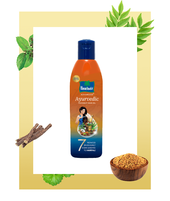 A bottle of Parachute Advansed Ayurvedic hair oil with ingredients