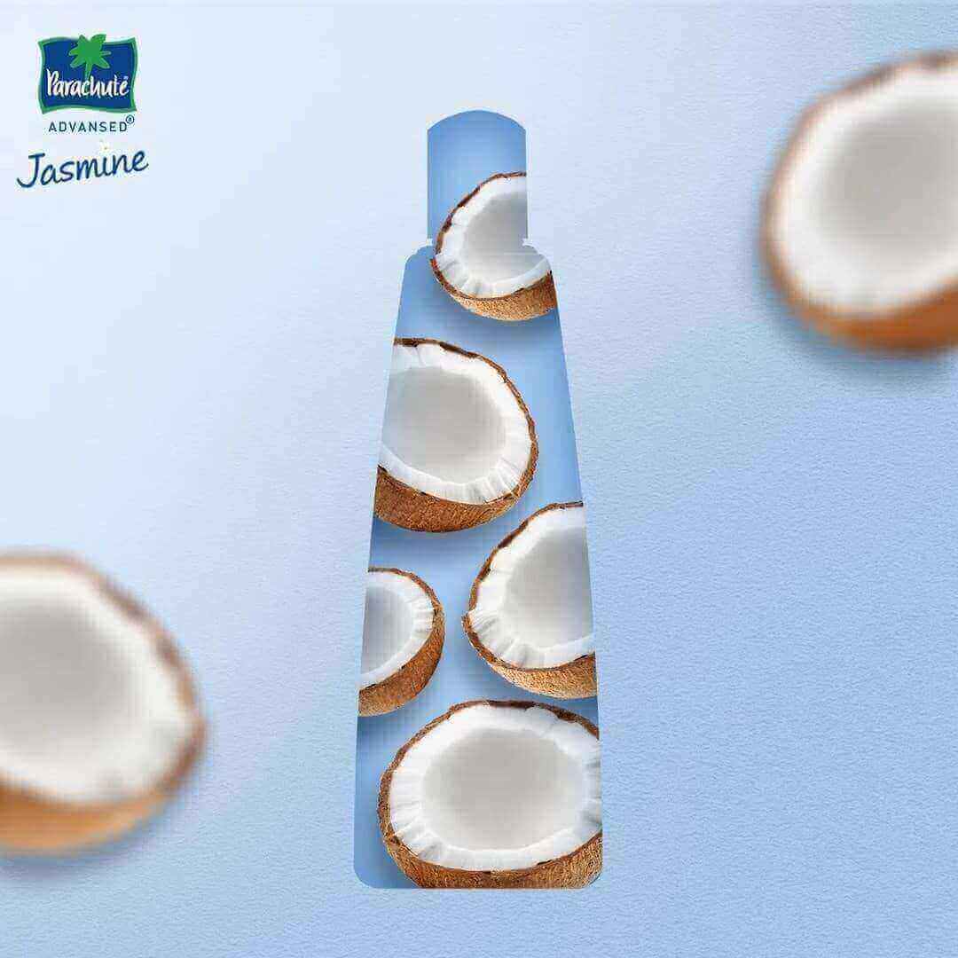 A watermark of a coconut based hair oil bottle